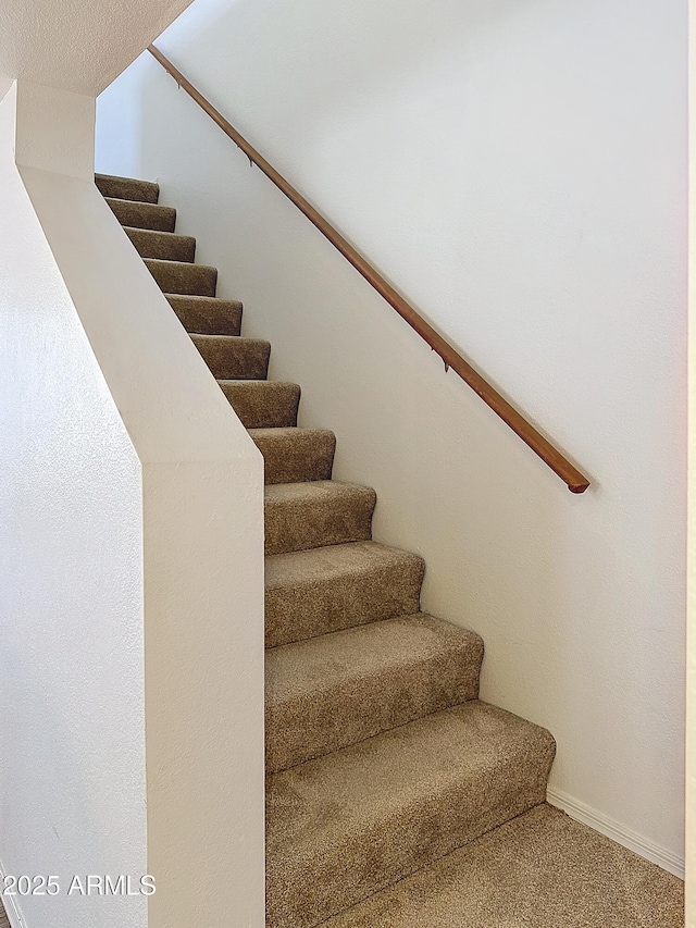 staircase with carpet