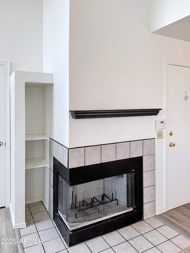 room details featuring a tiled fireplace