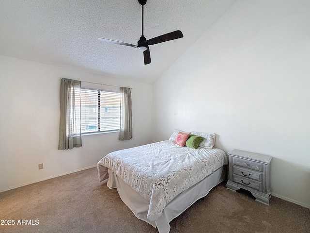 bedroom featuring ceiling fan, dark carpet, vaulted ceiling, and a textured ceiling