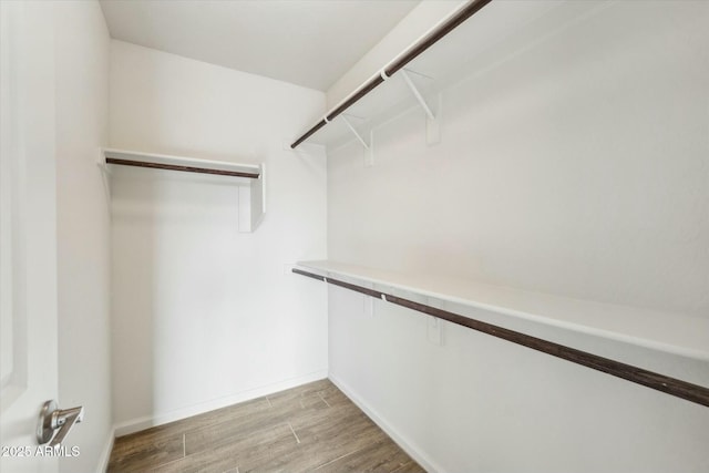 walk in closet featuring light wood-style floors