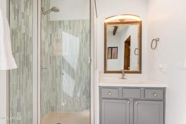 full bathroom with a stall shower and vanity