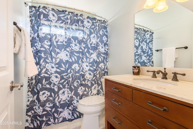 bathroom with vanity, toilet, and a shower with curtain