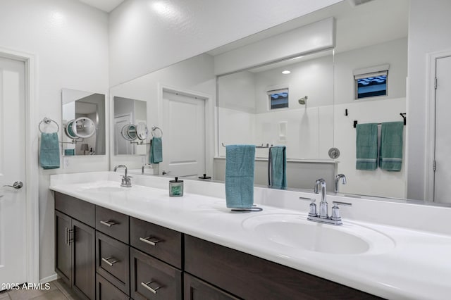 bathroom with double vanity and a sink