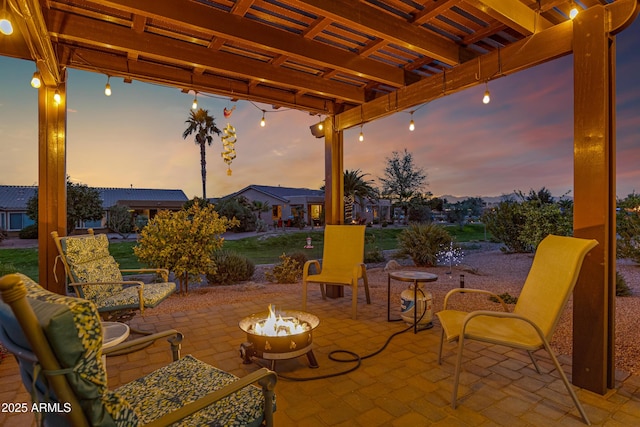 patio terrace at dusk with an outdoor fire pit