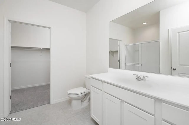 bathroom featuring tile patterned floors, vanity, an enclosed shower, and toilet