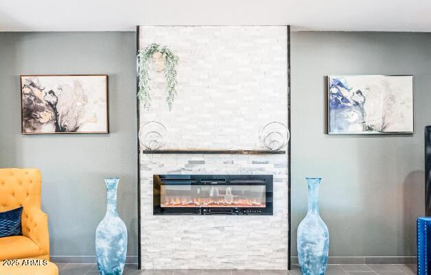 11215 N 37th Ave, Phoenix, AZ 85029 - living room with a fireplace, tile patterned flooring, and baseboards