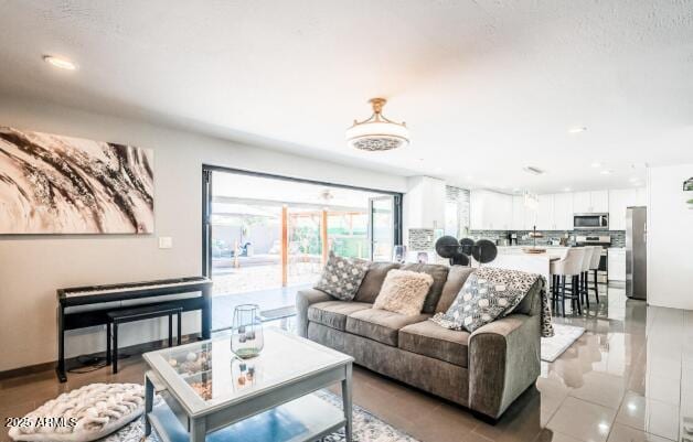 11215 N 37th Ave, Phoenix, AZ 85029 - living area featuring recessed lighting and light tile patterned flooring