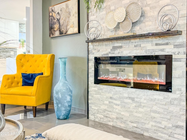 11215 N 37th Ave, Phoenix, AZ 85029 - living area featuring tile patterned flooring and a stone fireplace
