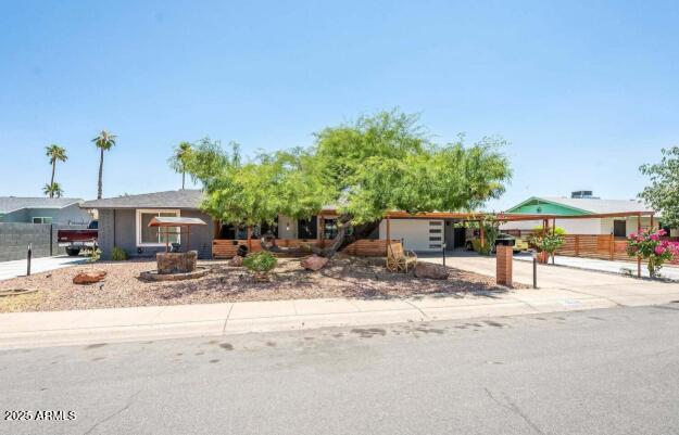 11215 N 37th Ave, Phoenix, AZ 85029 - ranch-style house with a carport and driveway