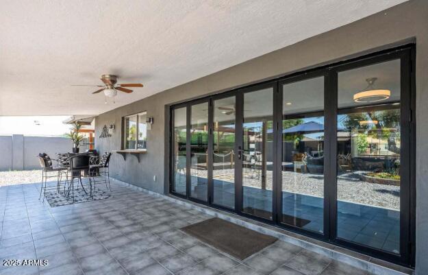 11215 N 37th Ave, Phoenix, AZ 85029 - view of patio with a ceiling fan and outdoor dining area