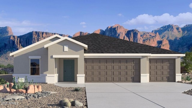 single story home featuring a garage, concrete driveway, roof with shingles, a mountain view, and stucco siding