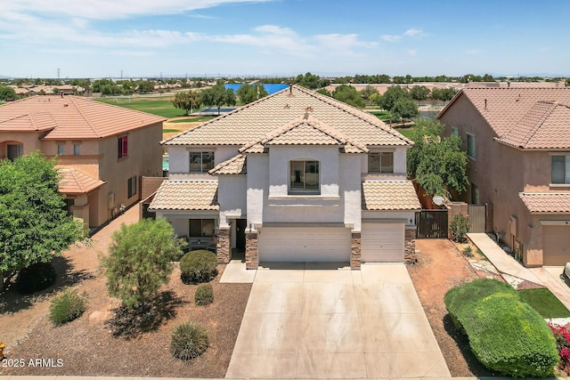 mediterranean / spanish-style home featuring a garage