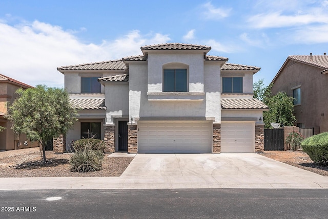 mediterranean / spanish home with a garage