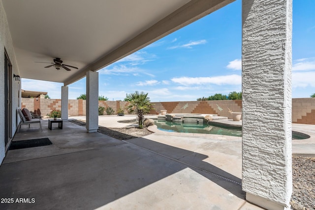 view of patio with a pool with hot tub and ceiling fan