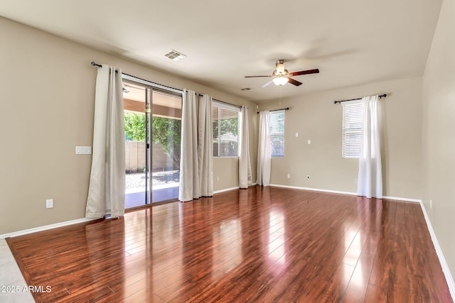 121 W Hackberry Dr, Chandler, AZ 85248 - spare room featuring a ceiling fan, wood finished floors, and baseboards