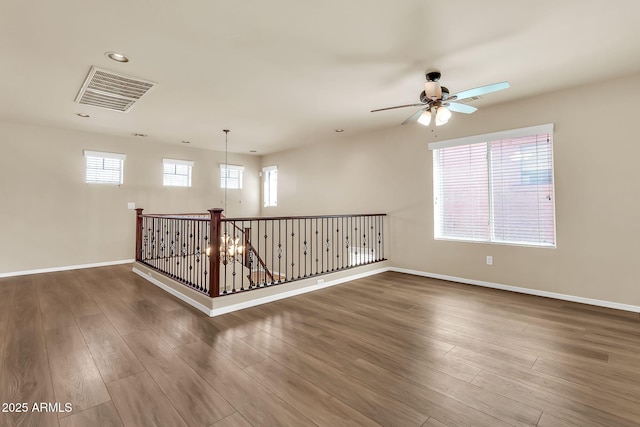 121 W Hackberry Dr, Chandler, AZ 85248 - spare room featuring ceiling fan, wood finished floors, baseboards, and recessed lighting