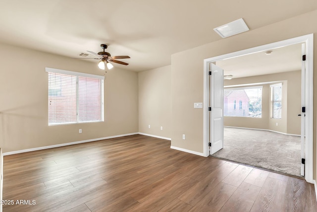 121 W Hackberry Dr, Chandler, AZ 85248 - spare room featuring a ceiling fan, wood finished floors, and baseboards