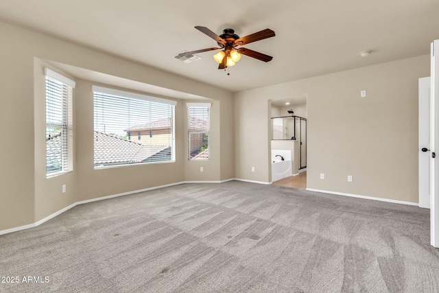 121 W Hackberry Dr, Chandler, AZ 85248 - spare room with a ceiling fan, light colored carpet, and baseboards