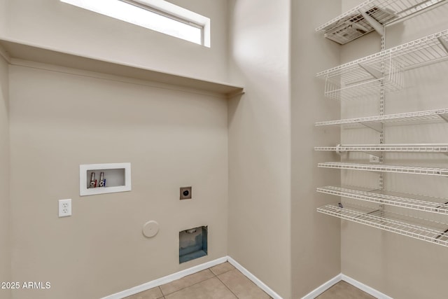 121 W Hackberry Dr, Chandler, AZ 85248 - clothes washing area with hookup for an electric dryer, baseboards, washer hookup, tile patterned flooring, and hookup for a gas dryer