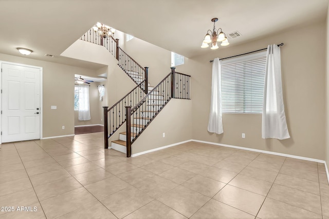 121 W Hackberry Dr, Chandler, AZ 85248 - entrance foyer with a chandelier, light tile patterned flooring, stairs, baseboards, and ceiling fan