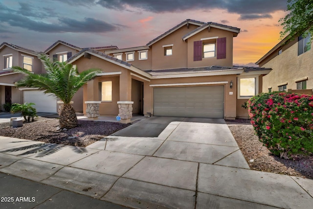 121 W Hackberry Dr, Chandler, AZ 85248 - view of front of property with stucco siding, a garage, concrete driveway, a tile roof, and stone siding