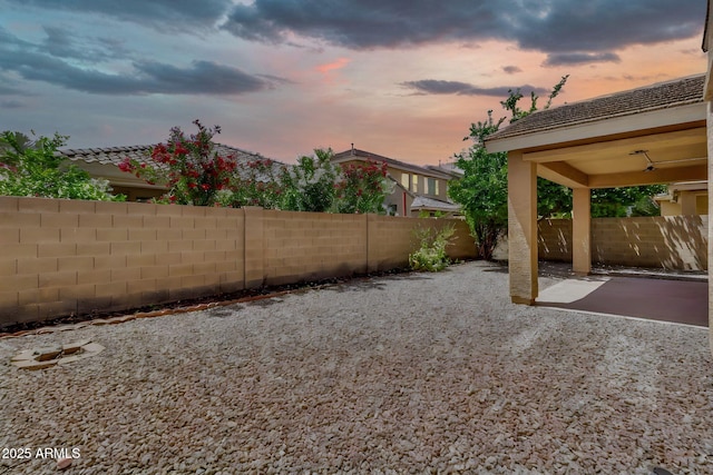 121 W Hackberry Dr, Chandler, AZ 85248 - yard at dusk featuring a patio area and a fenced backyard