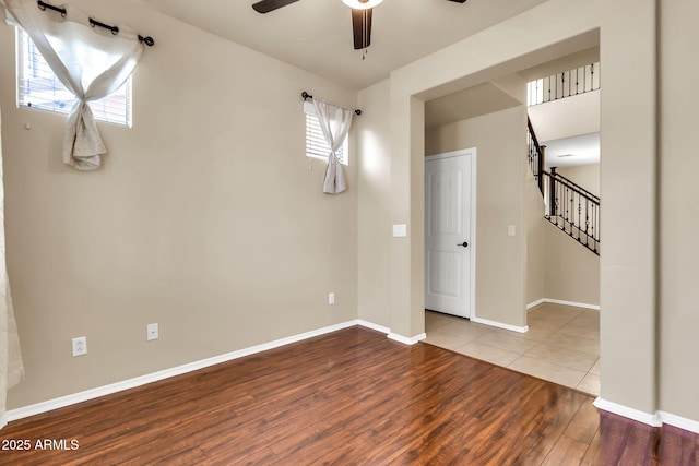 121 W Hackberry Dr, Chandler, AZ 85248 - unfurnished room with a ceiling fan, wood finished floors, baseboards, and stairway