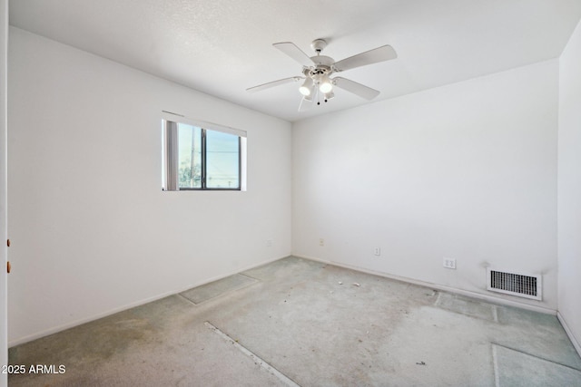 empty room with ceiling fan and visible vents