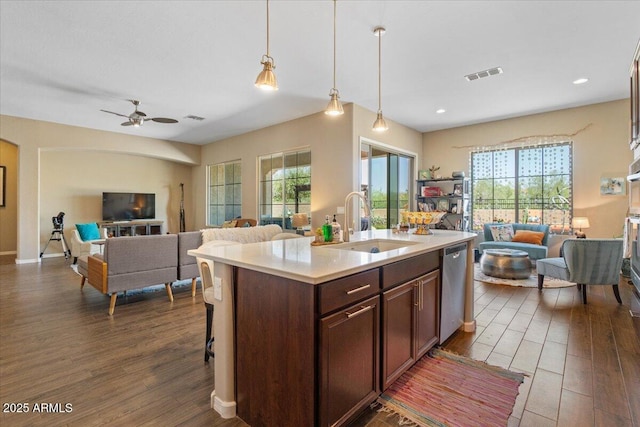 10914 E Tarragon Ave, Mesa, AZ 85212 - kitchen featuring open floor plan, dark wood-style floors, light countertops, hanging light fixtures, and recessed lighting