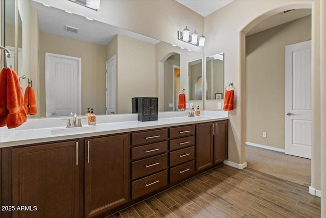 10914 E Tarragon Ave, Mesa, AZ 85212 - full bathroom with double vanity and wood finished floors