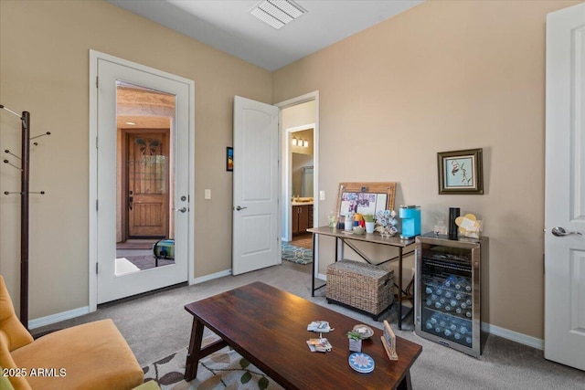10914 E Tarragon Ave, Mesa, AZ 85212 - living room with wine cooler and carpet floors