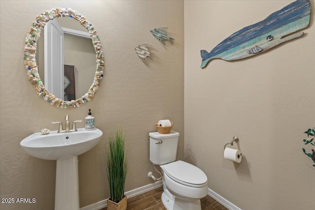 10914 E Tarragon Ave, Mesa, AZ 85212 - bathroom with toilet and wood finish floors