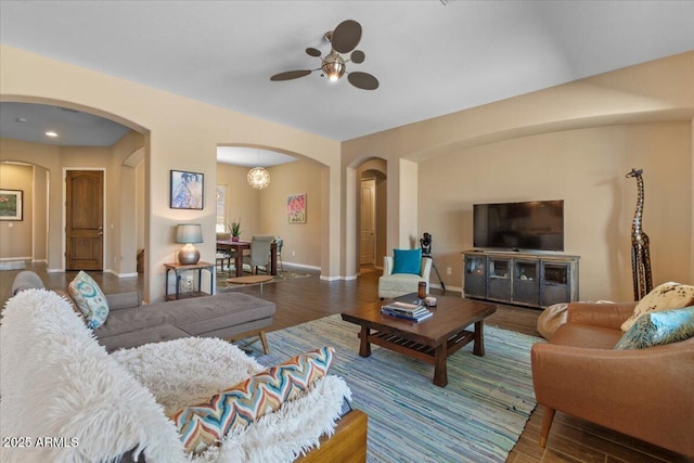 10914 E Tarragon Ave, Mesa, AZ 85212 - living room featuring a ceiling fan, arched walkways, and wood finished floors