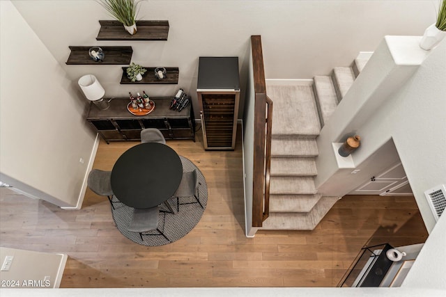 staircase with hardwood / wood-style flooring