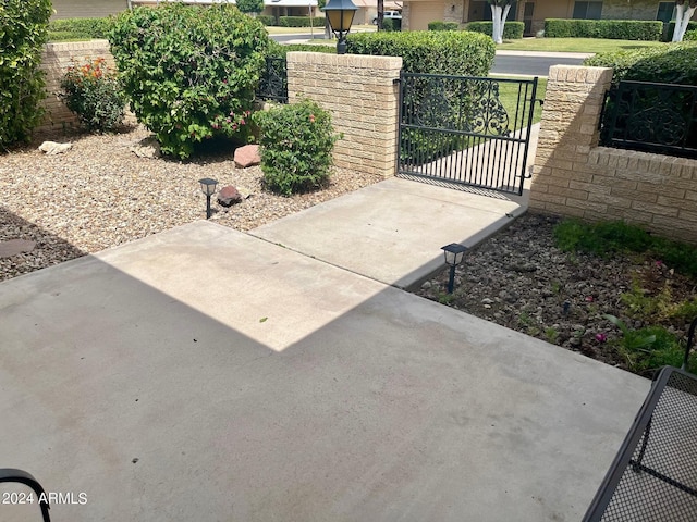 view of gate with fence