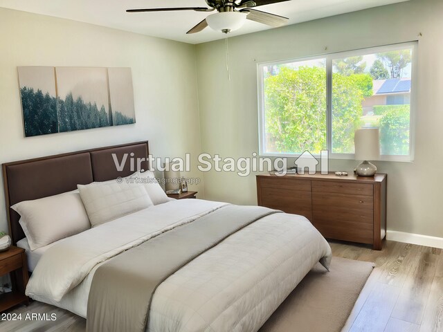 kitchen featuring light hardwood / wood-style flooring, stainless steel dishwasher, sink, and a healthy amount of sunlight