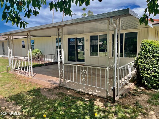 view of patio / terrace featuring a sunroom