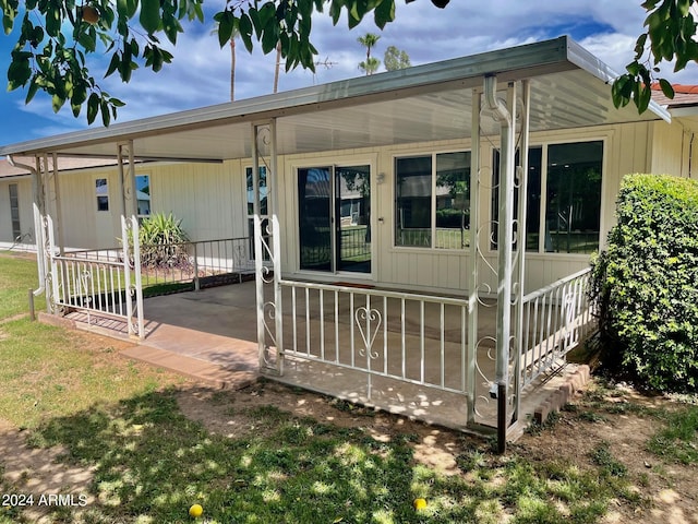 exterior space featuring a carport
