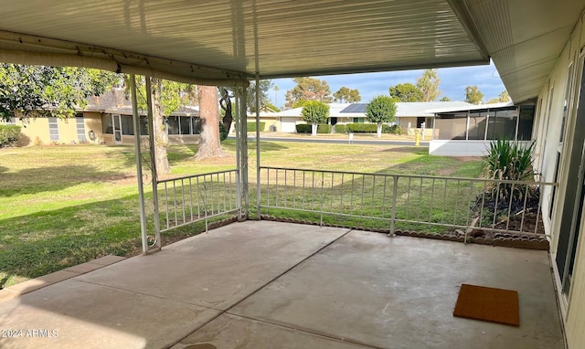 view of patio / terrace featuring a residential view and a sunroom