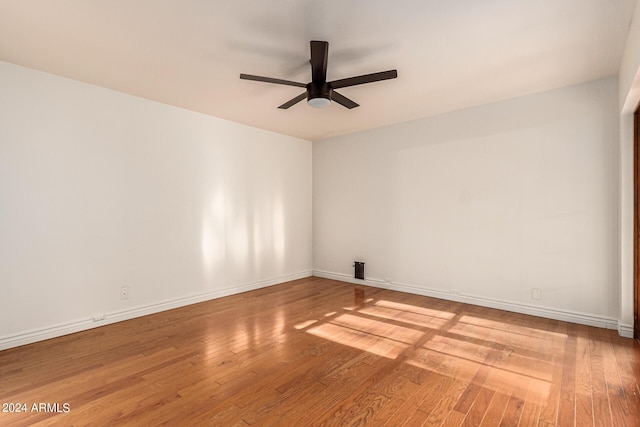 unfurnished room with ceiling fan and light hardwood / wood-style floors