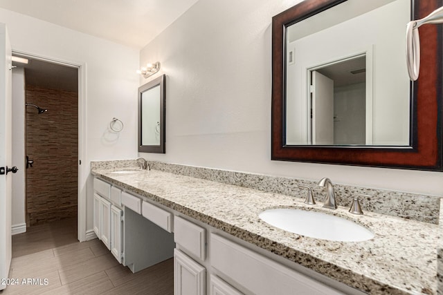 bathroom featuring tile patterned floors and vanity