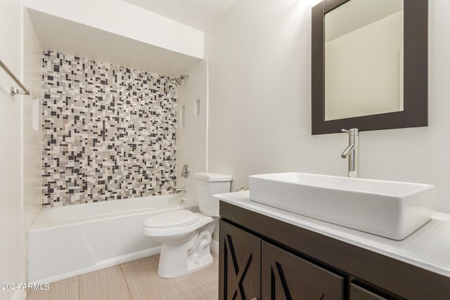 full bathroom with vanity, toilet, and tiled shower / bath combo