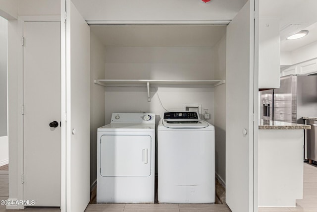 laundry room featuring independent washer and dryer