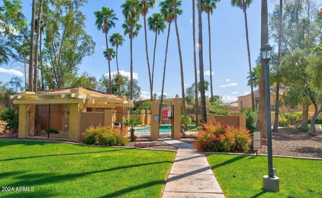 view of home's community featuring a lawn