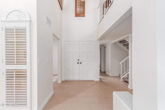 foyer entrance with a high ceiling