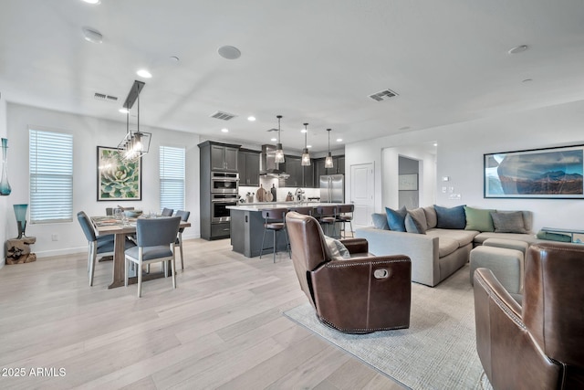 living room with light hardwood / wood-style flooring