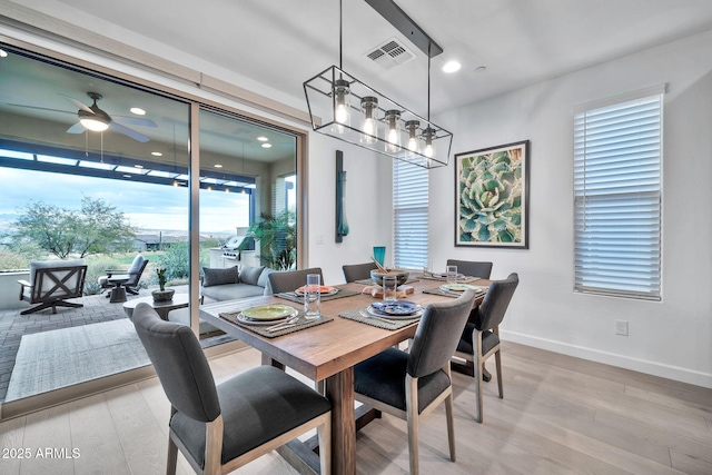 dining room featuring ceiling fan and wood-type flooring