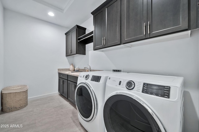 washroom with independent washer and dryer and cabinets