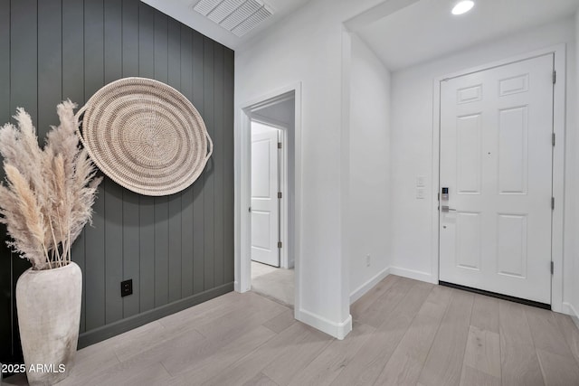 entryway with light hardwood / wood-style flooring