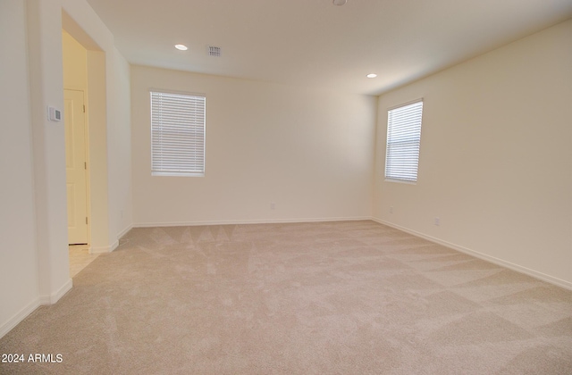 empty room with light colored carpet